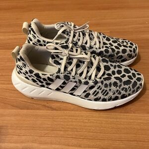 Women’s nude and black adidas